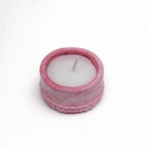 Pink concrete mini candle holder with white wax and single wick.